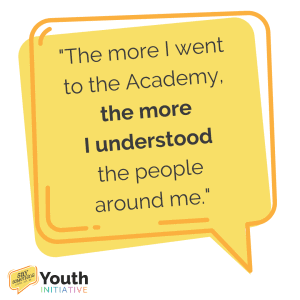 A yellow and orange speech bubble with the words "The more I went to the Academy, the more I understood the people around me". with the Say Something Youth Initiative logo in the bottom left corner.
